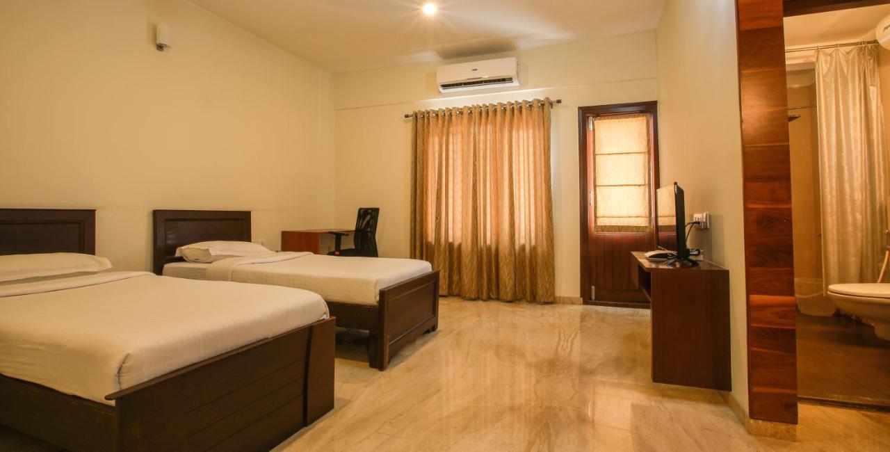 Falcon Suites Yelahanka New Town Бангалор Экстерьер фото