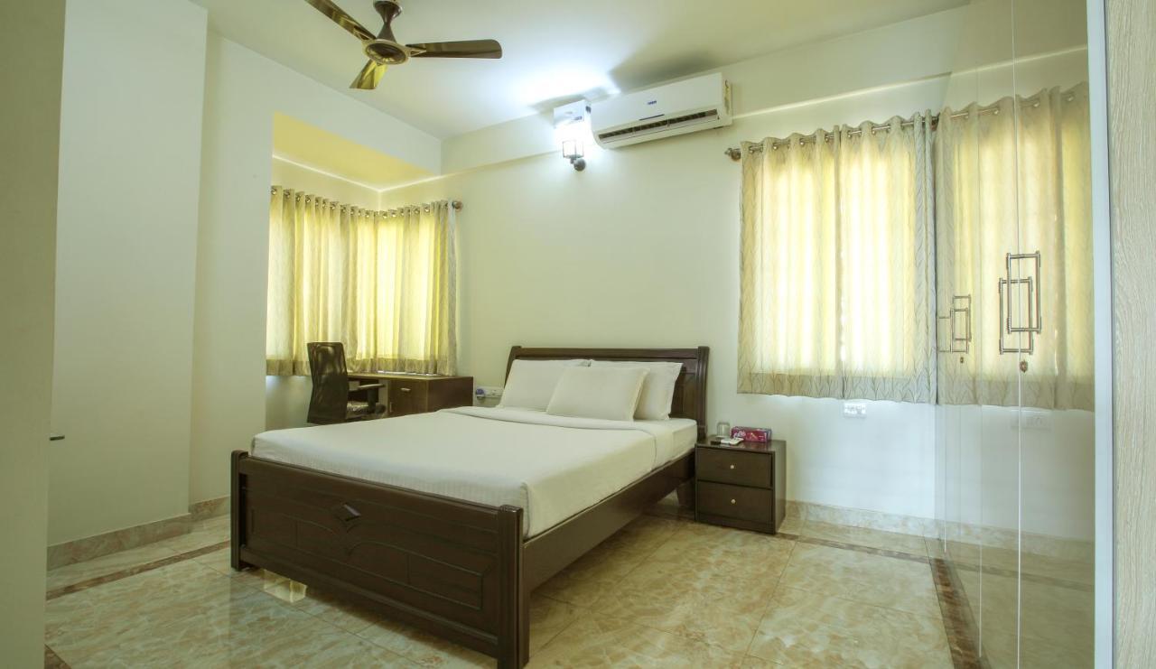 Falcon Suites Yelahanka New Town Бангалор Экстерьер фото